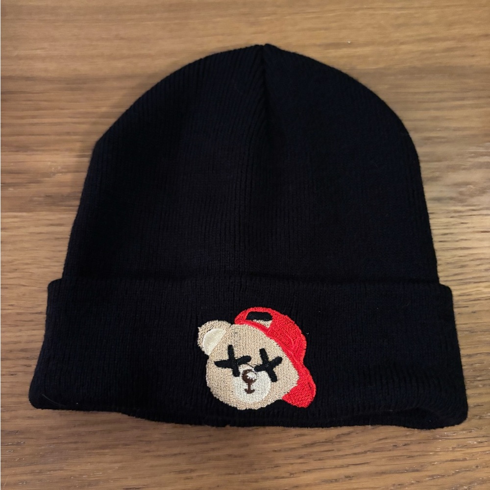Kids black beanie with a bear wearing a red hat